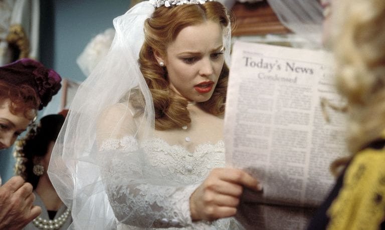 Bride Looking at Newspaper