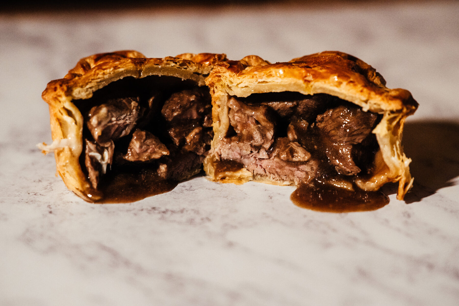 Beef bourguignon pie in a golden flaky pastry