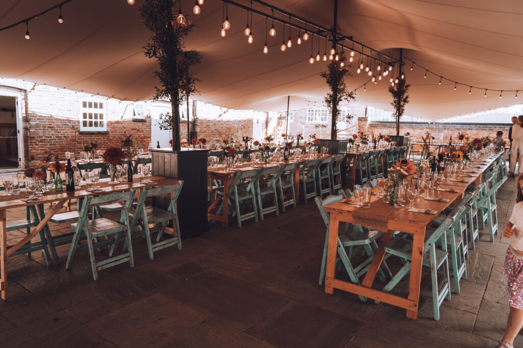 The Courtyard at The Old Cow Shed set up ready for a wedding breakfast.